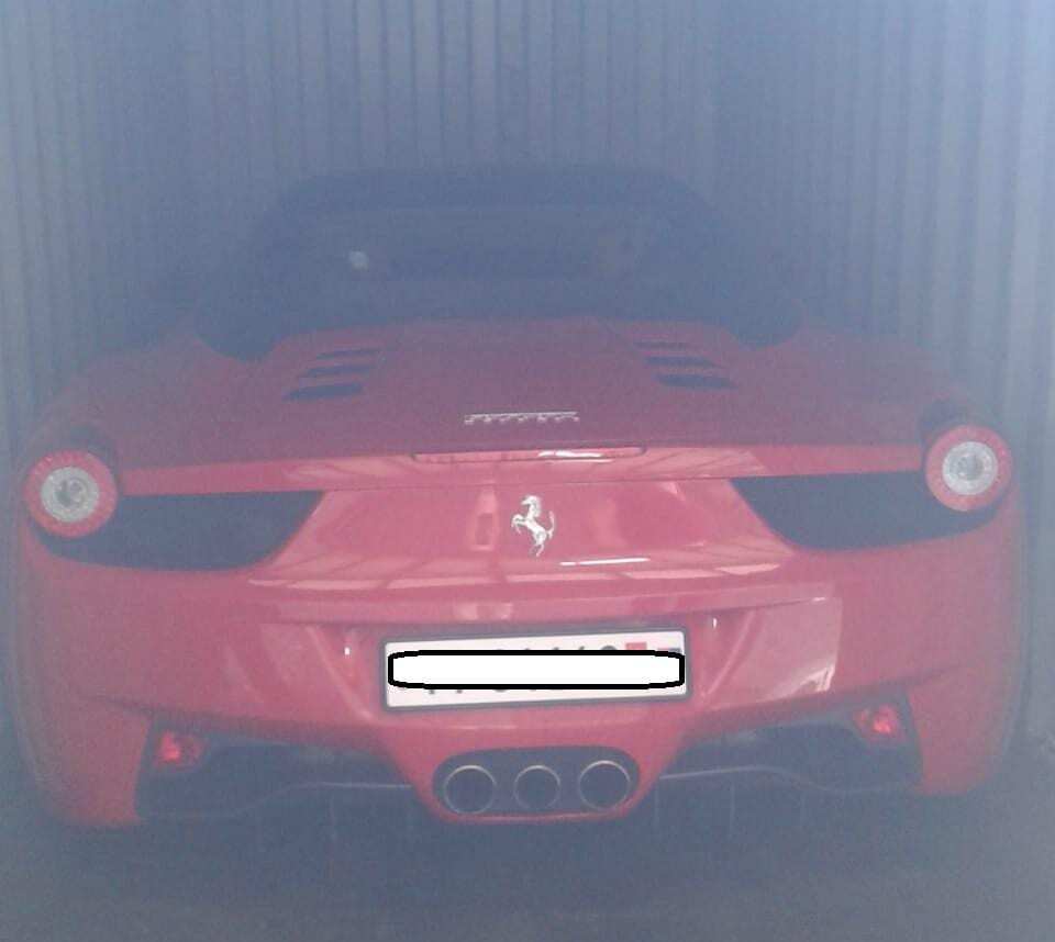Ferrari loaded in a container